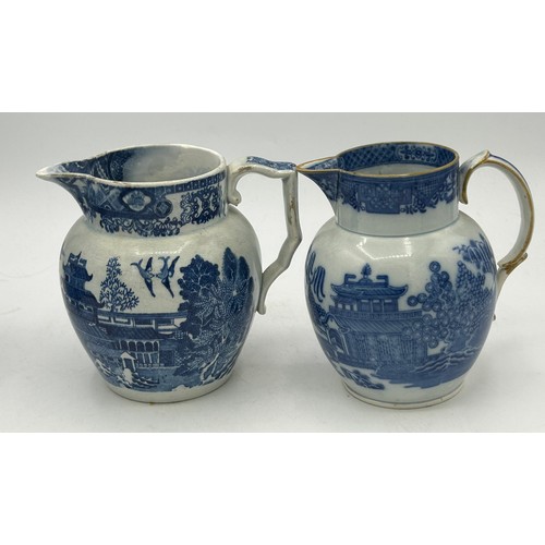 180 - A group of early 19th century blue and white transfer-printed jugs and a mug, c. 1800-10. To include... 