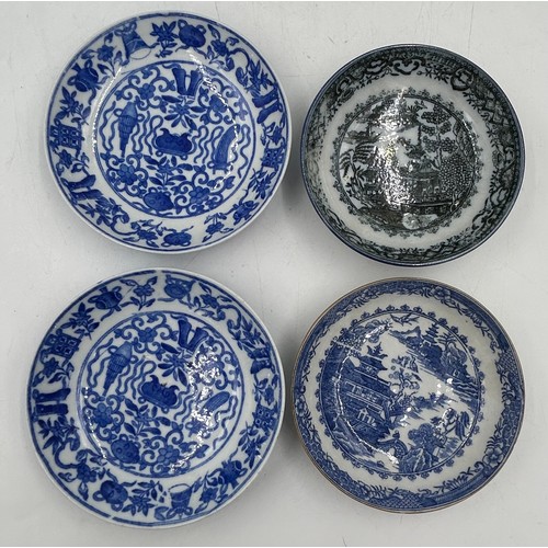 188 - A large group of early 19th century blue and white transfer-printed saucers and larger saucer dishes... 