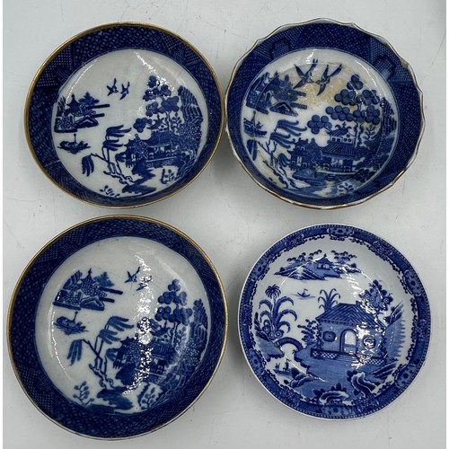 188 - A large group of early 19th century blue and white transfer-printed saucers and larger saucer dishes... 