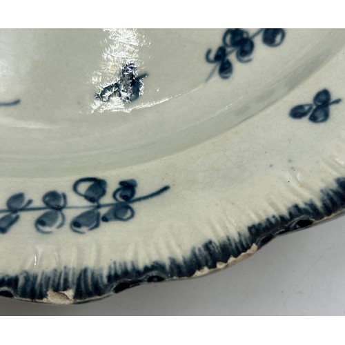 221 - A group of early 19th century blue and white hand-painted pearlware shell edge Chinese floral design... 