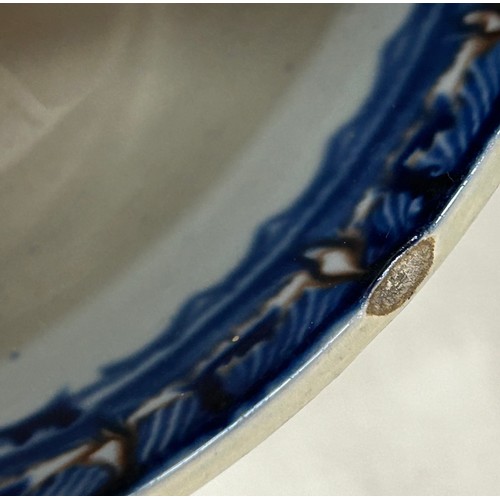 223 - A group of early 19th century blue and white hand-painted pearlware shell edge and other items, c. 1... 