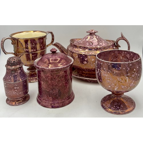 228 - A group of early 19th century pink lustre spatterware pieces, c. 1820. To include a loving cup, pepp... 