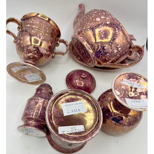 228 - A group of early 19th century pink lustre spatterware pieces, c. 1820. To include a loving cup, pepp... 