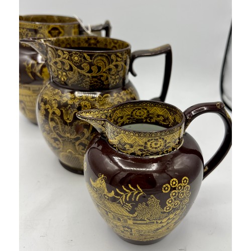 230 - A group of early 19th century yellow printed brown glaze jugs, c. 1805-10. To include Fig Tree, Nels... 