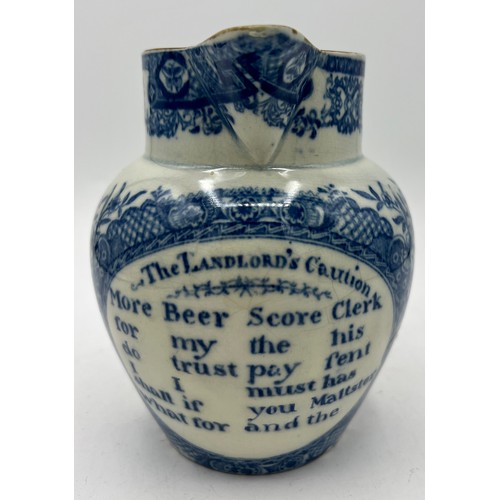 233 - An early 19th century blue and white transfer-printed Landlord's Caution jug, together with a blue a... 