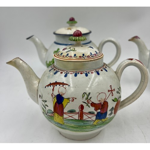 240 - A group of early 19th century hand-painted pearlware teapots, c. 1810. One is decorated with a peafo... 