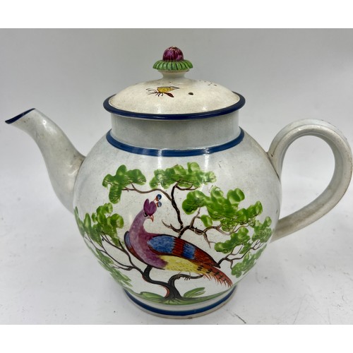 240 - A group of early 19th century hand-painted pearlware teapots, c. 1810. One is decorated with a peafo... 