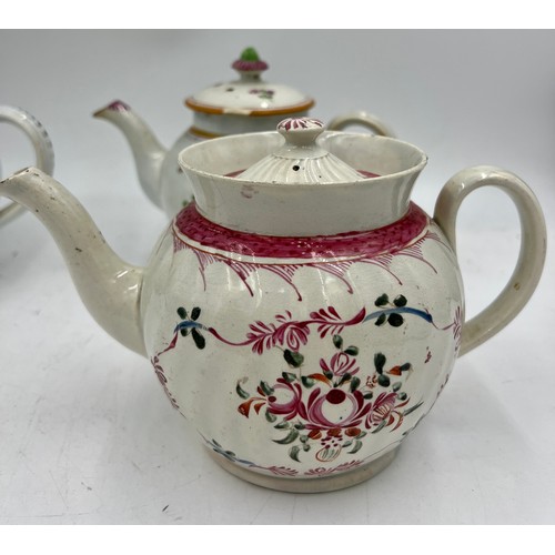 240 - A group of early 19th century hand-painted pearlware teapots, c. 1810. One is decorated with a peafo... 