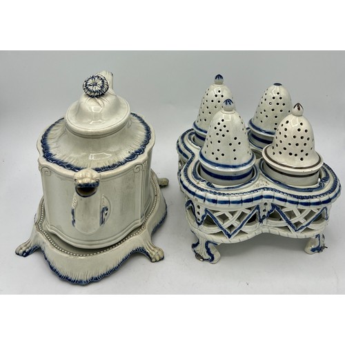 243 - Two early 19th century blue hand-painted pearlware pieces, c. 1810. To include: a cruet set and a te... 