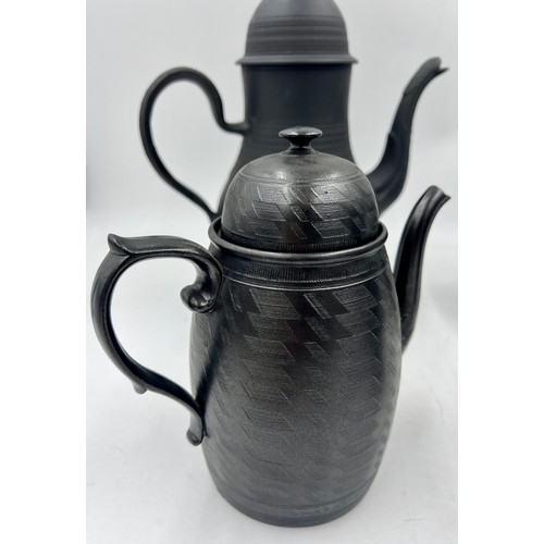 244 - A group of early 19th century black basalt coffee pots and covers, c. 1810. Some are engine turned, ... 