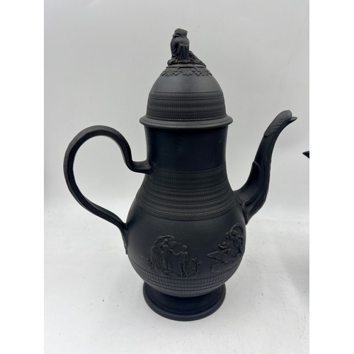 244 - A group of early 19th century black basalt coffee pots and covers, c. 1810. Some are engine turned, ... 