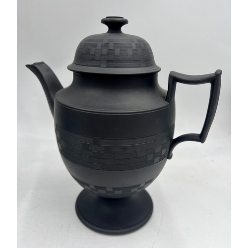 244 - A group of early 19th century black basalt coffee pots and covers, c. 1810. Some are engine turned, ... 