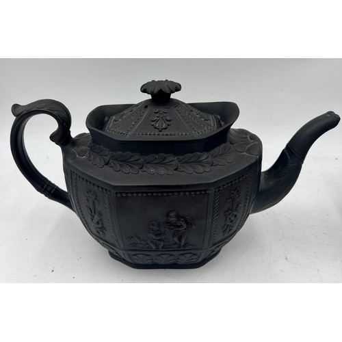 245 - A group of early 19th century black basalt classical design teapots and covers, c. 1810. Tallest: 16... 