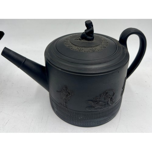 245 - A group of early 19th century black basalt classical design teapots and covers, c. 1810. Tallest: 16... 