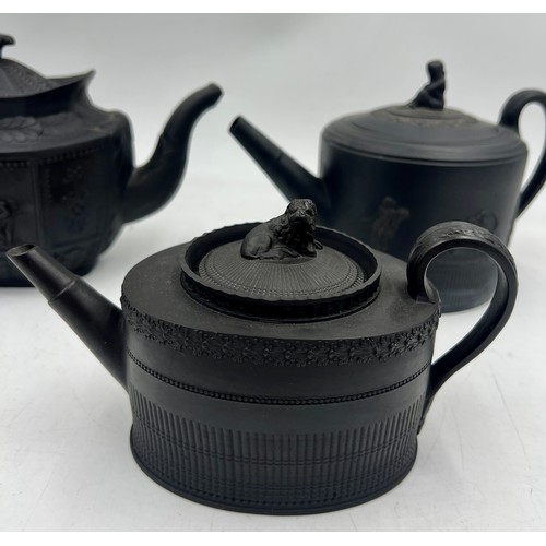 245 - A group of early 19th century black basalt classical design teapots and covers, c. 1810. Tallest: 16... 