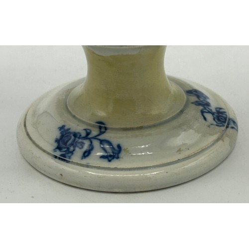 265 - An early 19th century blue and white transfer-printed loving cup, c. 1815. It has four vignettes wit... 