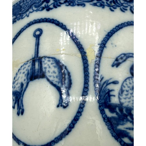 265 - An early 19th century blue and white transfer-printed loving cup, c. 1815. It has four vignettes wit... 