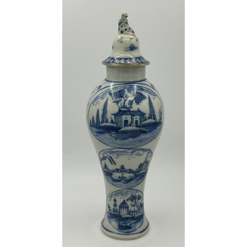 274 - An early 19th century hand-painted blue and white pearlware large lidded vase, c. 1800. It has paint... 