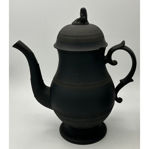 285 - A group of early 19th century engine turned black basalt wares, c. 1810. To include two lidded coffe... 