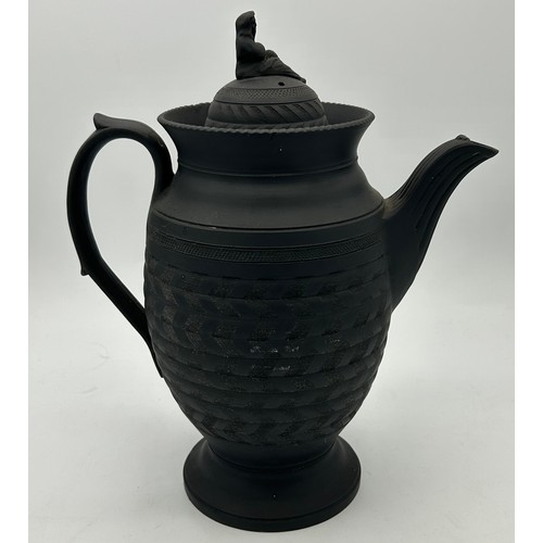 285 - A group of early 19th century engine turned black basalt wares, c. 1810. To include two lidded coffe... 