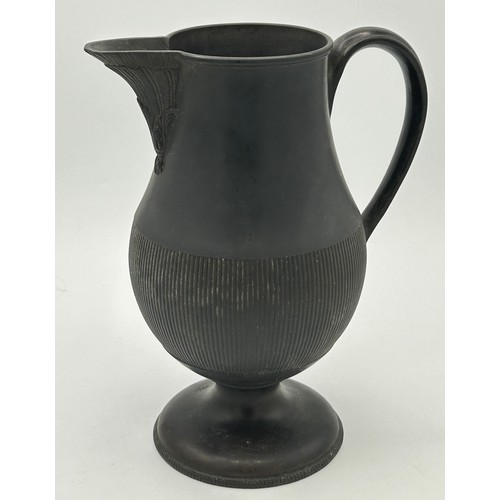 285 - A group of early 19th century engine turned black basalt wares, c. 1810. To include two lidded coffe... 