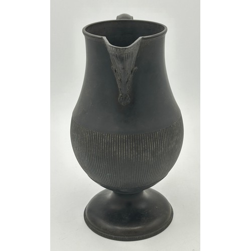 285 - A group of early 19th century engine turned black basalt wares, c. 1810. To include two lidded coffe... 