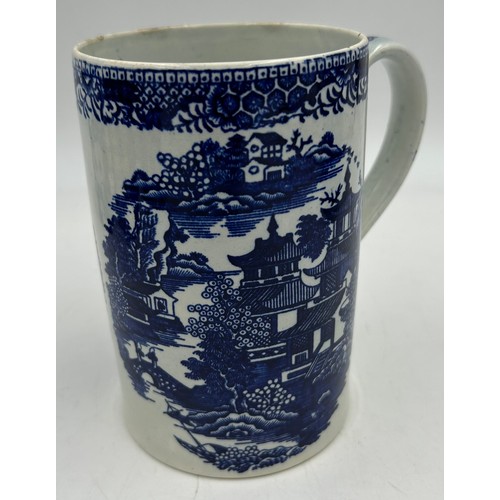 291 - A group of five early 19th century blue and white transfer printed chinoiserie pattern mugs, c. 1800... 