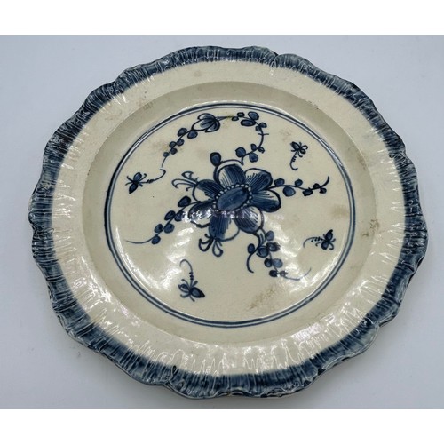 294 - A group of early 19th century blue and white hand-painted pearlware shell edge plates with floral de... 