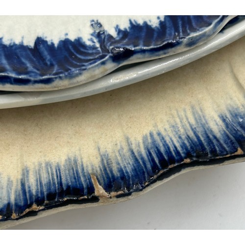 295 - A group of early 19th century blue and white hand-painted pearlware shell edge plates with chinoiser... 