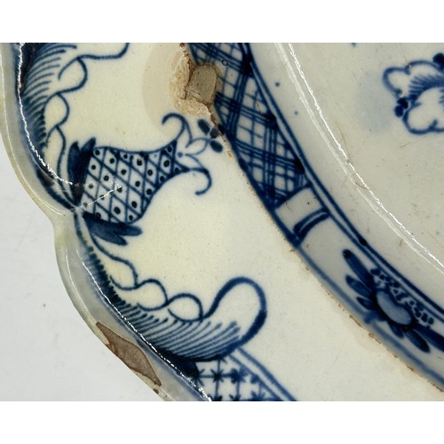 306 - Two early 19th century blue and white hand-painted, shell edge platters, one with a Chinese figure, ... 