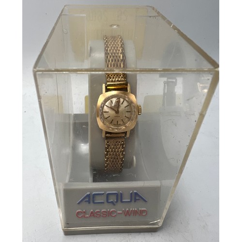 770 - An Oscar ladies 18 carat gold cased wristwatch on a gold plated bracelet. Total weight 21.5gm.