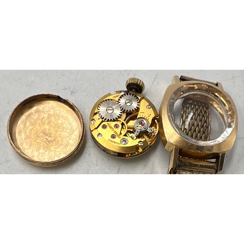 770 - An Oscar ladies 18 carat gold cased wristwatch on a gold plated bracelet. Total weight 21.5gm.