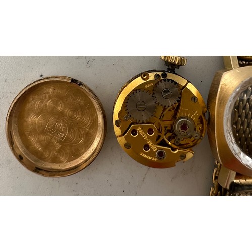 770 - An Oscar ladies 18 carat gold cased wristwatch on a gold plated bracelet. Total weight 21.5gm.