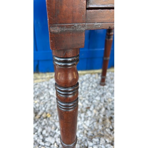 13 - A 19thC mahogany table with 2 drawers and drop leaf sides.
34cm un-extended, 74cm extended x 53cm d ... 