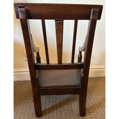 159 - An early 19thC child's armchair. Ht to back 58cm, to seat 20cm.