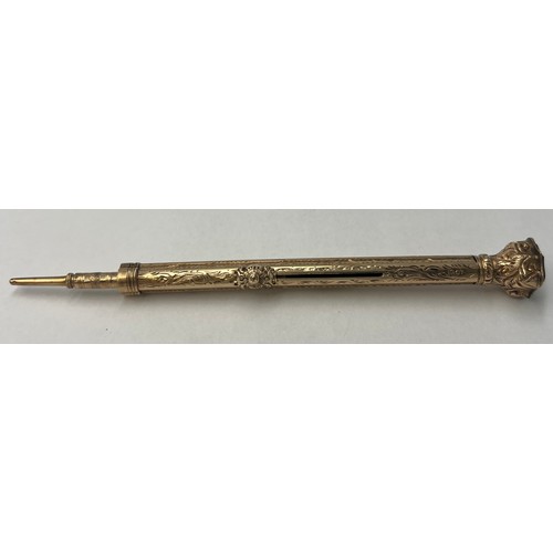 522 - A 9 carat gold seal topped retractable propelling pencil and nib pen. Weight 14.25gm. 9 cm l unexten... 