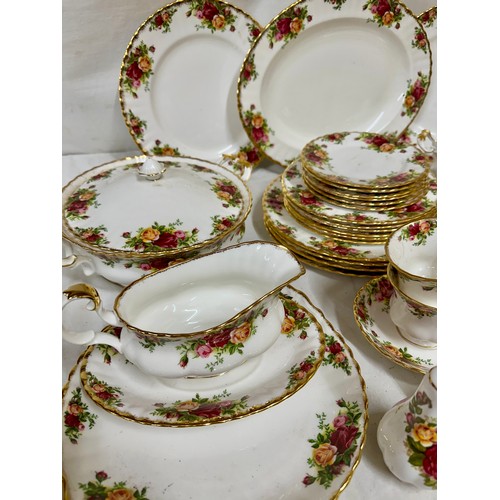 446 - A Royal Albert Country Roses part dinner and tea service to include 1x meat plate measuring 35cm, 6x... 