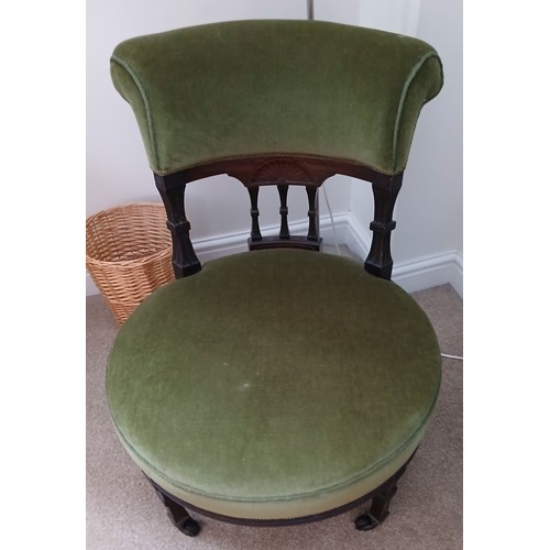 147 - An Edwardian green velvet upholstered nursing  chair. 60cm deep x 71cm h x 32cm h to seat.