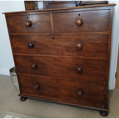 153 - A 19thC mahogany chest of two short over three long drawers on bun feet with wooden knobs. 107cm x 5... 