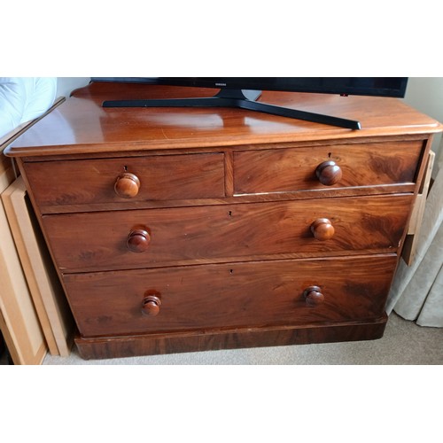 154 - A 19thC mahogany chest of two short over two long drawers with wooden knobs. 106cm x 55cm x 76cm h.