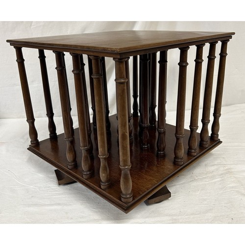 96 - An Edwardian mahogany tabletop rotating bookcase. 34cm squared x 31cm high.