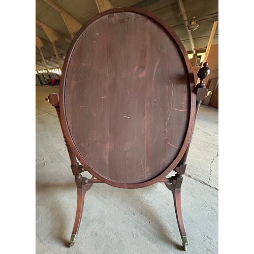 16 - A mahogany cheval mirror.
157cm h x 96cm w x 66cm d.