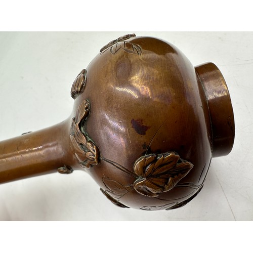 1037 - Two oriental bronze bowls with marks to base and a vase decorated with chrysanthemums 15cm h.