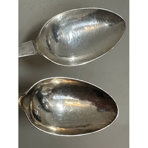 930 - A pair of .925 silver spoons, maker Georg Jensen Weight 129gm. Length 20.5cm.