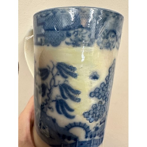 235 - A group of early 19th century blue and white transfer-printed chinoiserie pattern mugs, c. 1800-10. ... 