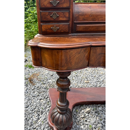 74 - A 19thC figured burr walnut dressing table with frieze drawers, swivel mirror, seven drawers to top ... 