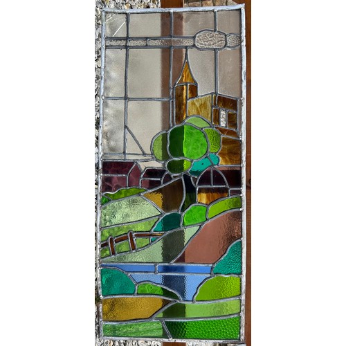 5B - Two stained glass windows depicting church and windmill. Each 94 x 40cm. Not now in frames.