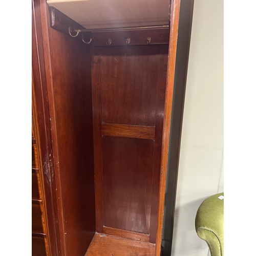 140 - A Edwardian mahogany inlaid compactum/wardrobe with mirrored doors to either side of central cupboar... 