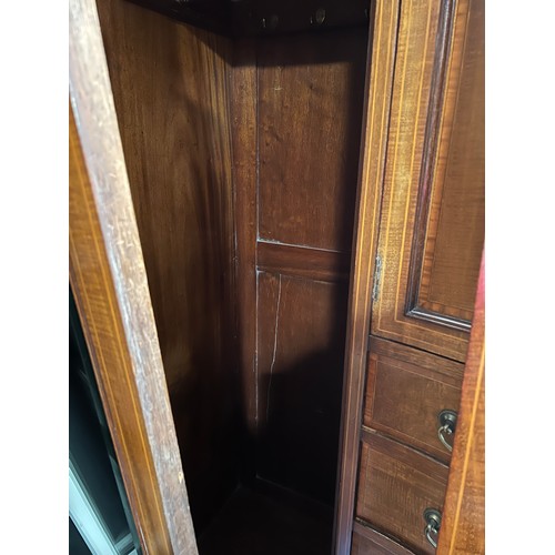 140 - A Edwardian mahogany inlaid compactum/wardrobe with mirrored doors to either side of central cupboar... 