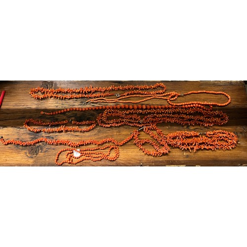 576 - A large quantity of vintage coral beads, some in need of rethreading. One necklace with 9 carat gold... 